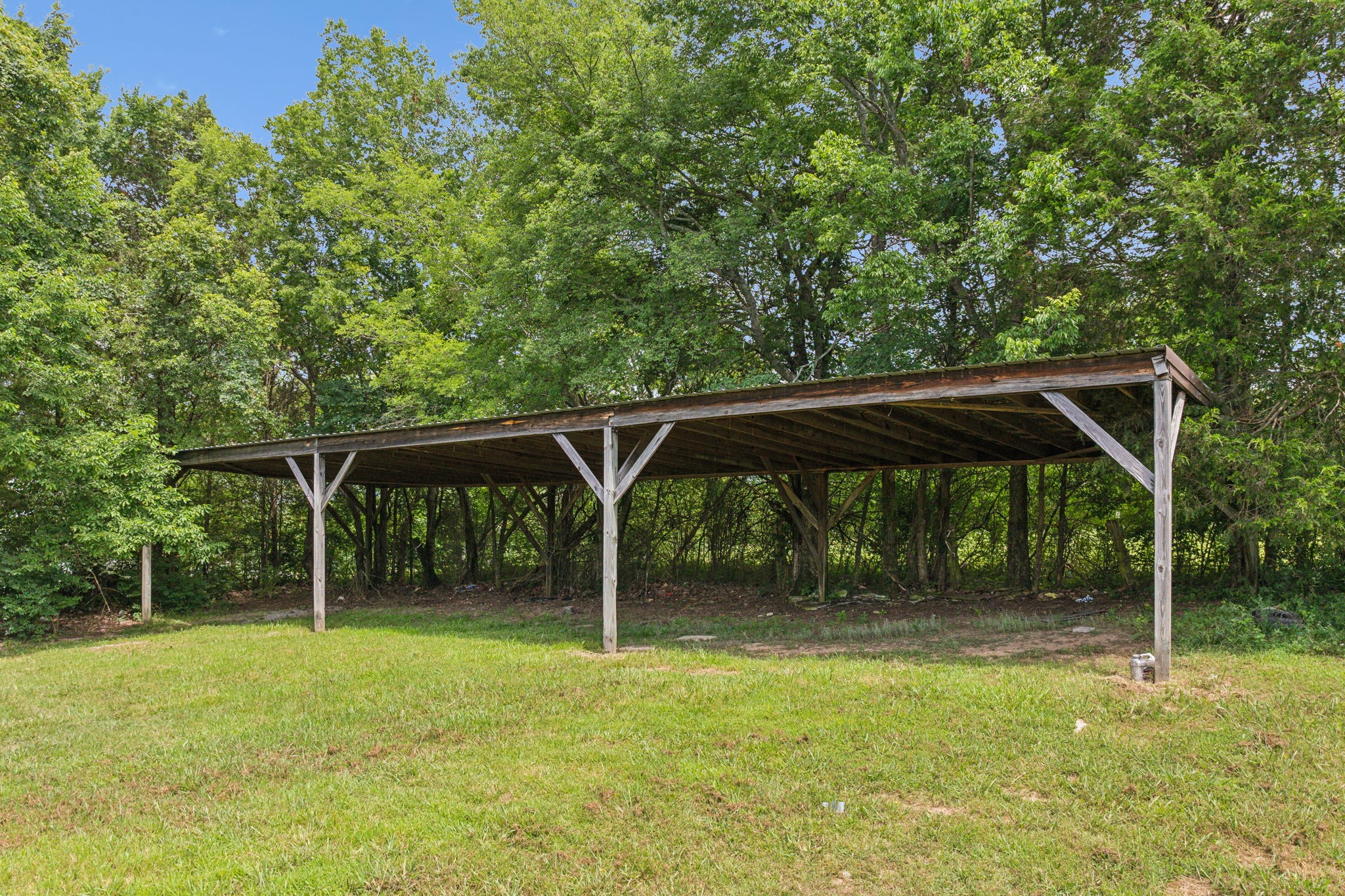 969 Trice Road Lebanon, TN 37087 - Photo 42 of 47 a backyard of a house with swing and slide