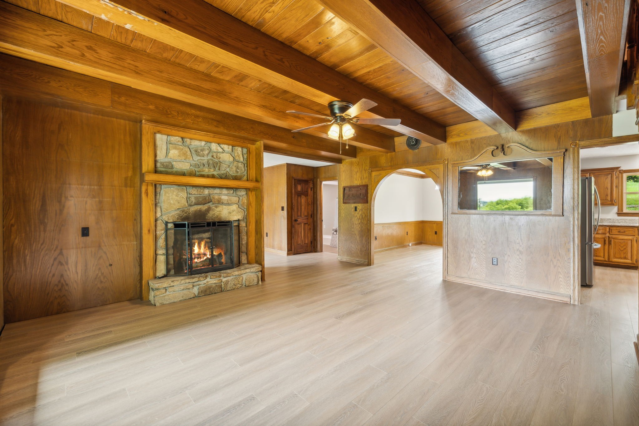 969 Trice Road Lebanon, TN 37087 - Photo 9 of 47 a view of empty room with wooden floor and fireplace