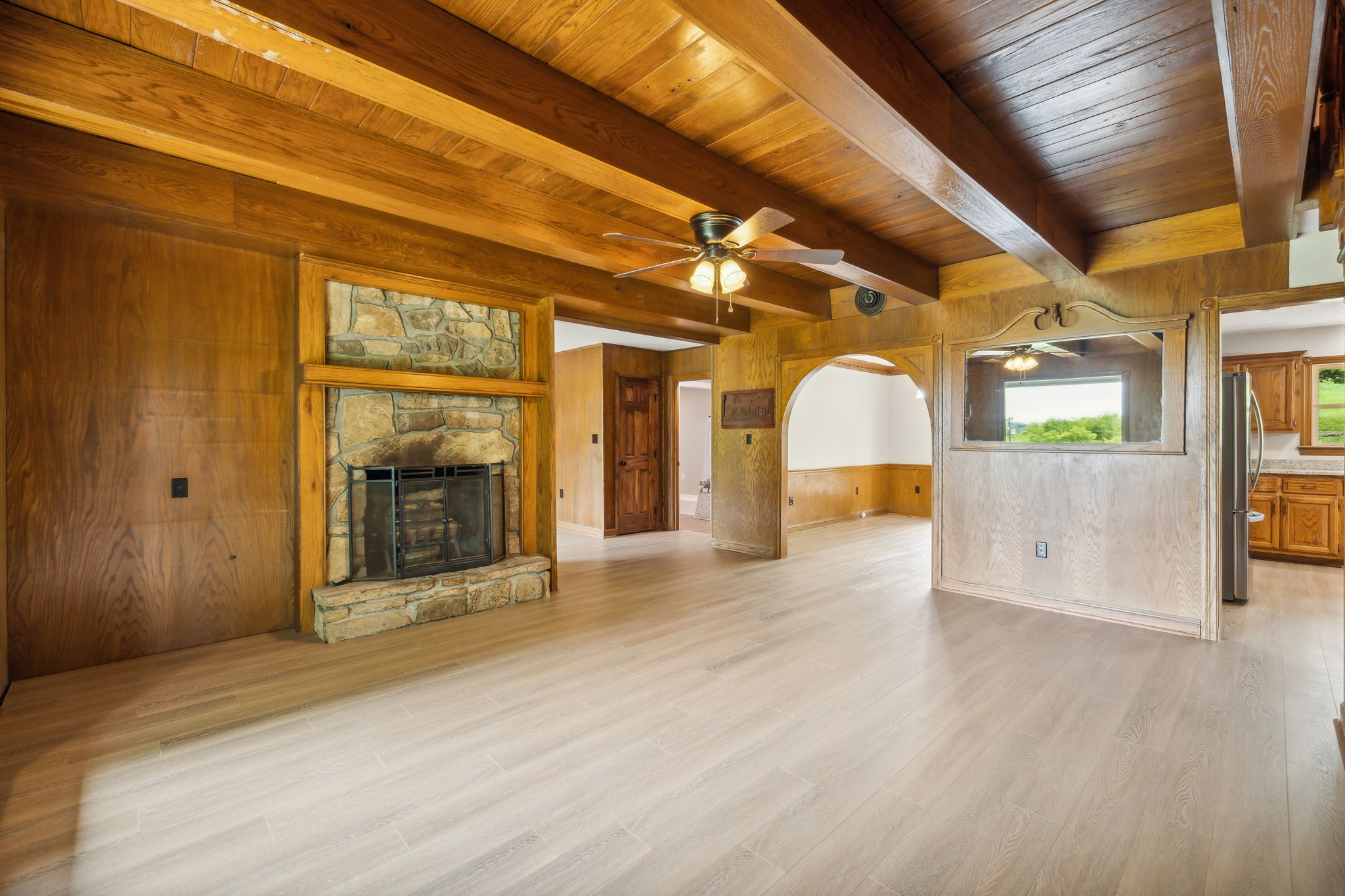 969 Trice Road Lebanon, TN 37087 - Photo 10 of 47 a view of a hallway with wooden floor and a fireplace