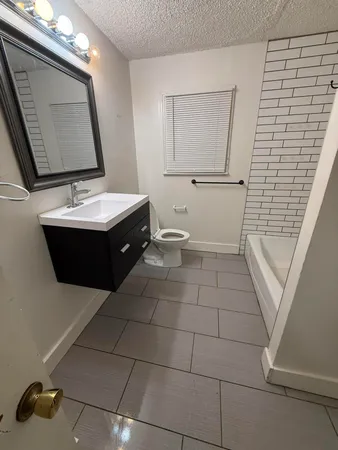 a bathroom with a white bathtub