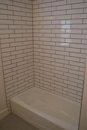 a view of a hallway with washer and dryer
