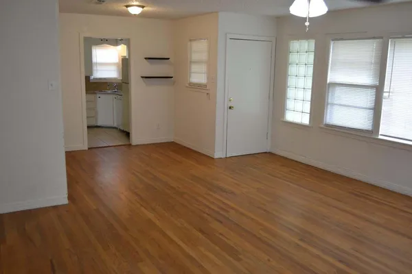 a kitchen with appliances cabinets and a stove top oven