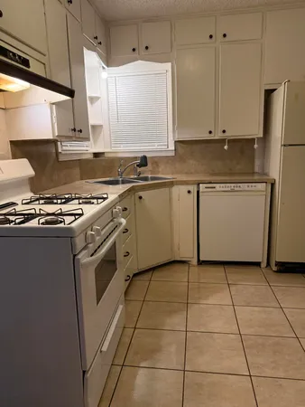 a bathroom with a sink vanity and toilet
