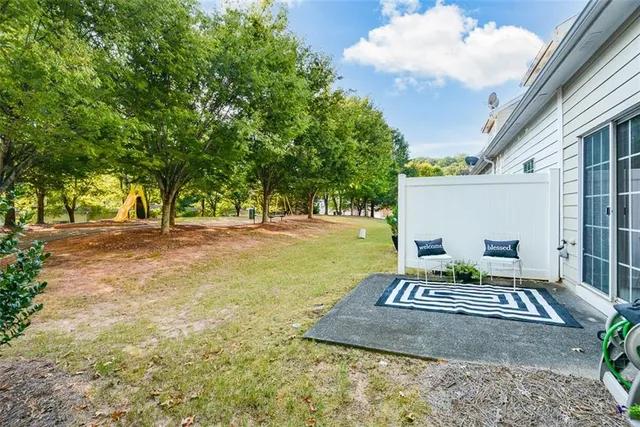 a view of backyard with a garden and entertaining space