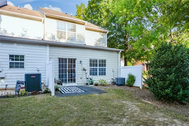 a view of a house with a garden and plants