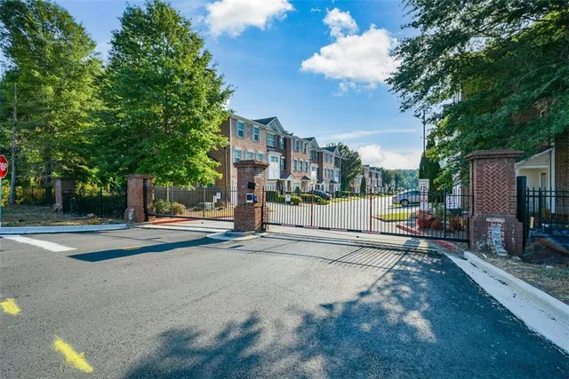 a view of a street with houses on both side