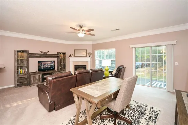 a view of a livingroom with furniture and window