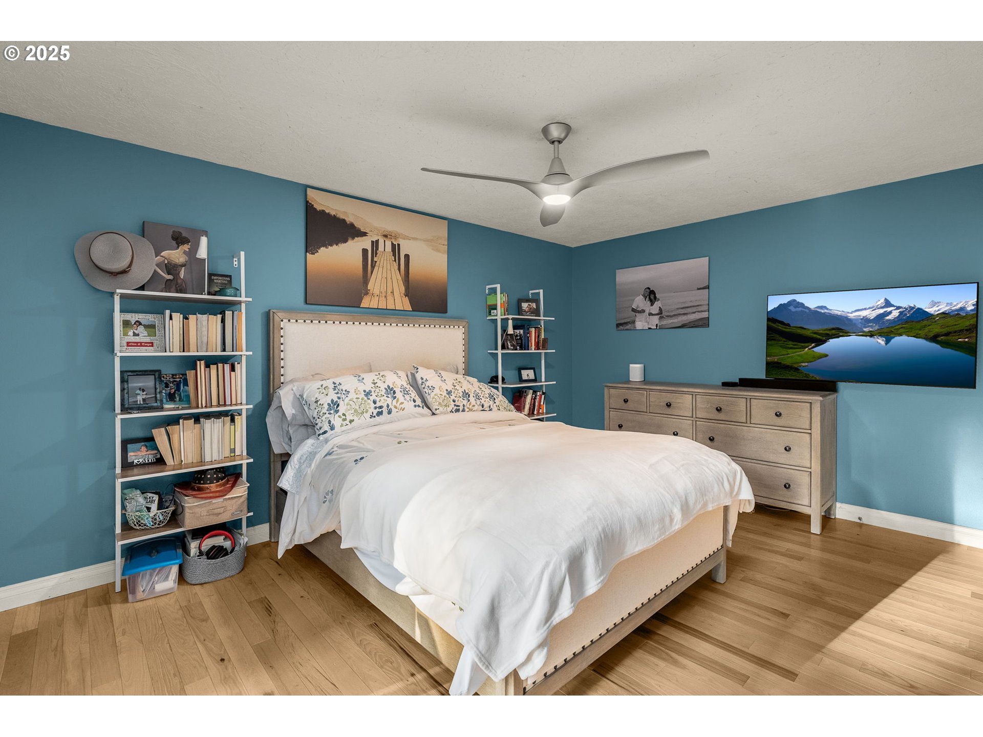18863 Southwest Indian Springs Road Lake Oswego, OR 97035 - Photo 15 of 33 a bedroom with a bed and a book shelf