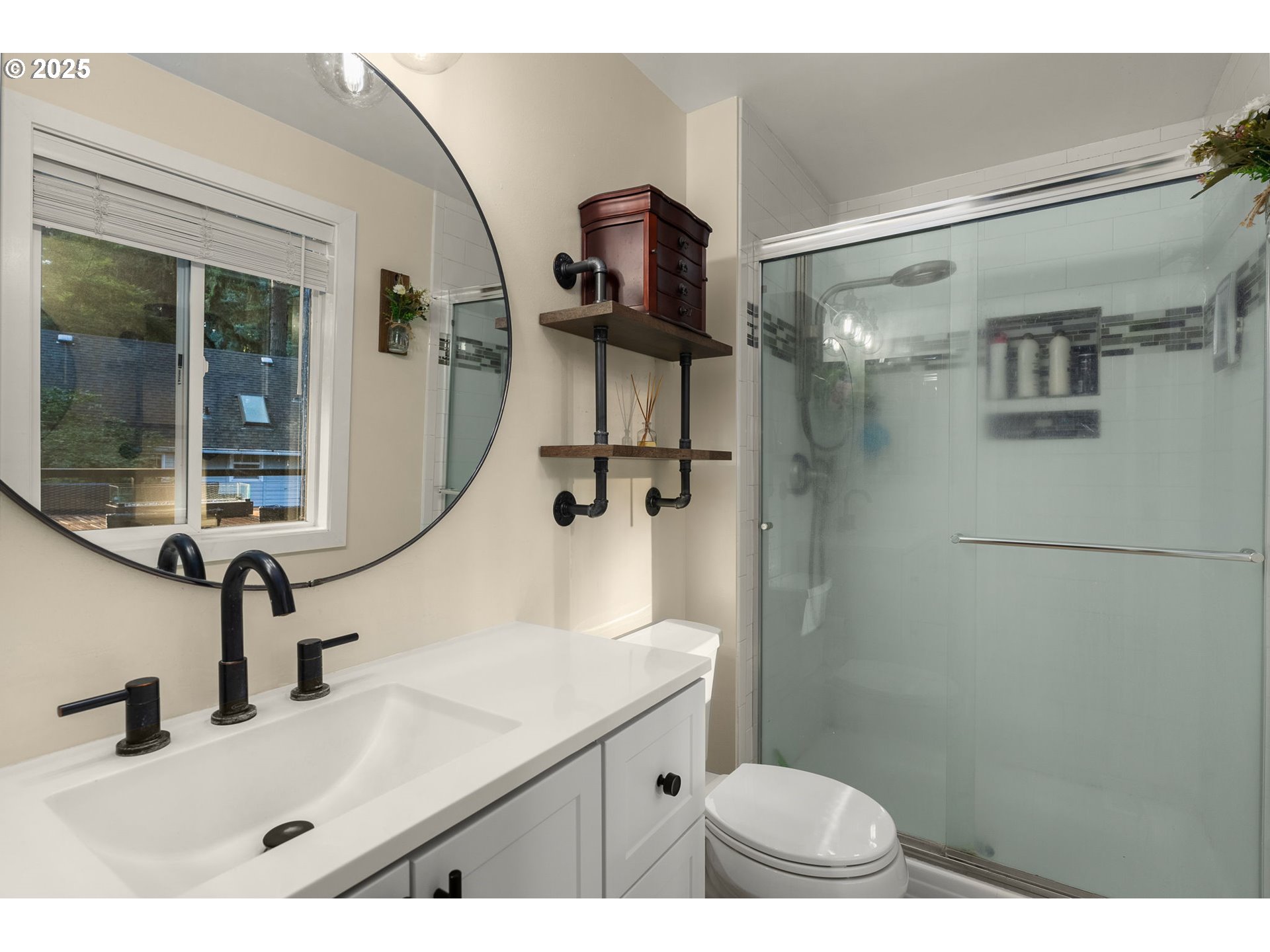 18863 Southwest Indian Springs Road Lake Oswego, OR 97035 - Photo 16 of 33 a bathroom with a sink a toilet and shower