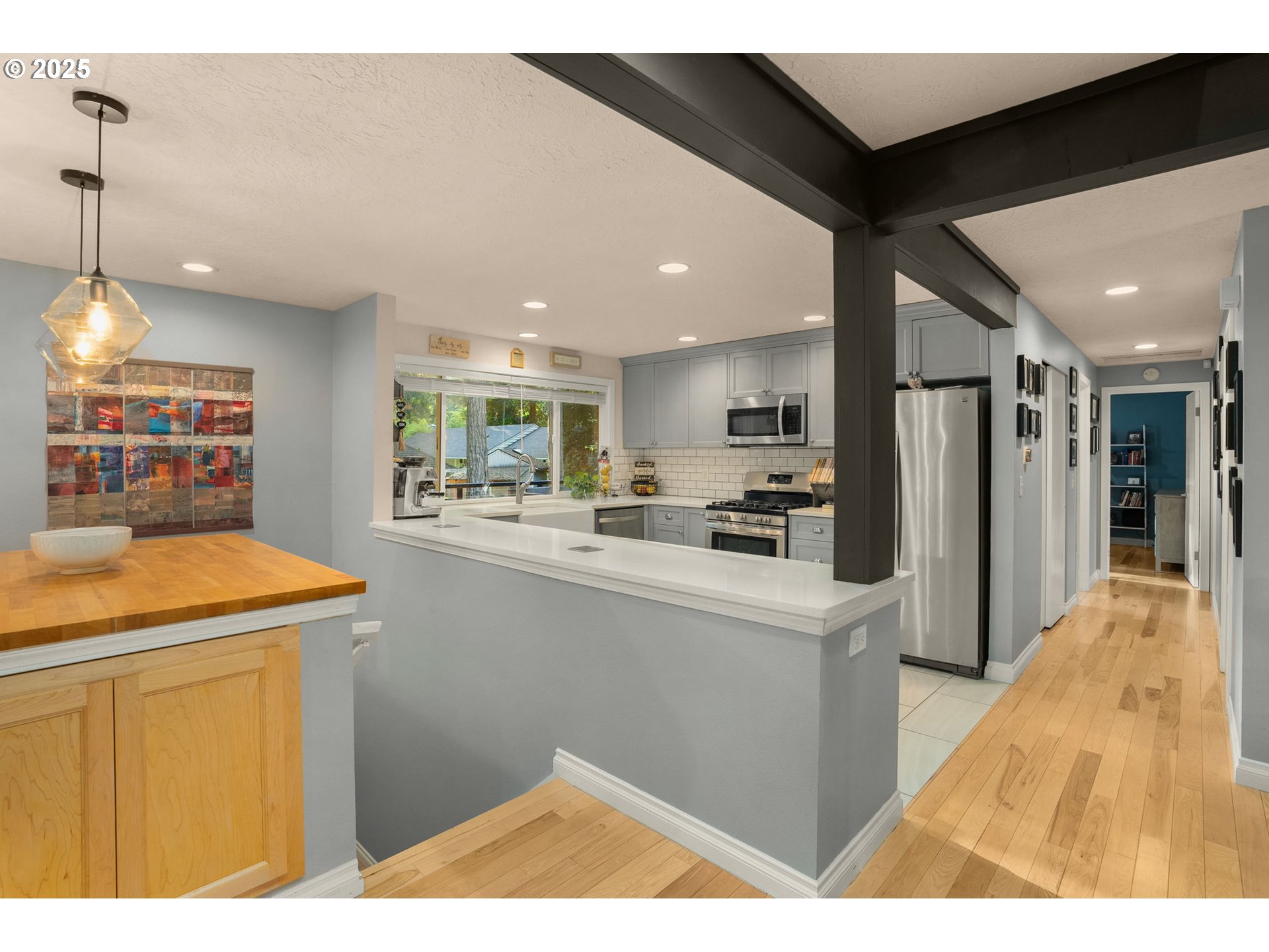 18863 Southwest Indian Springs Road Lake Oswego, OR 97035 - Photo 20 of 33 a kitchen with stainless steel appliances kitchen island a refrigerator sink and cabinets