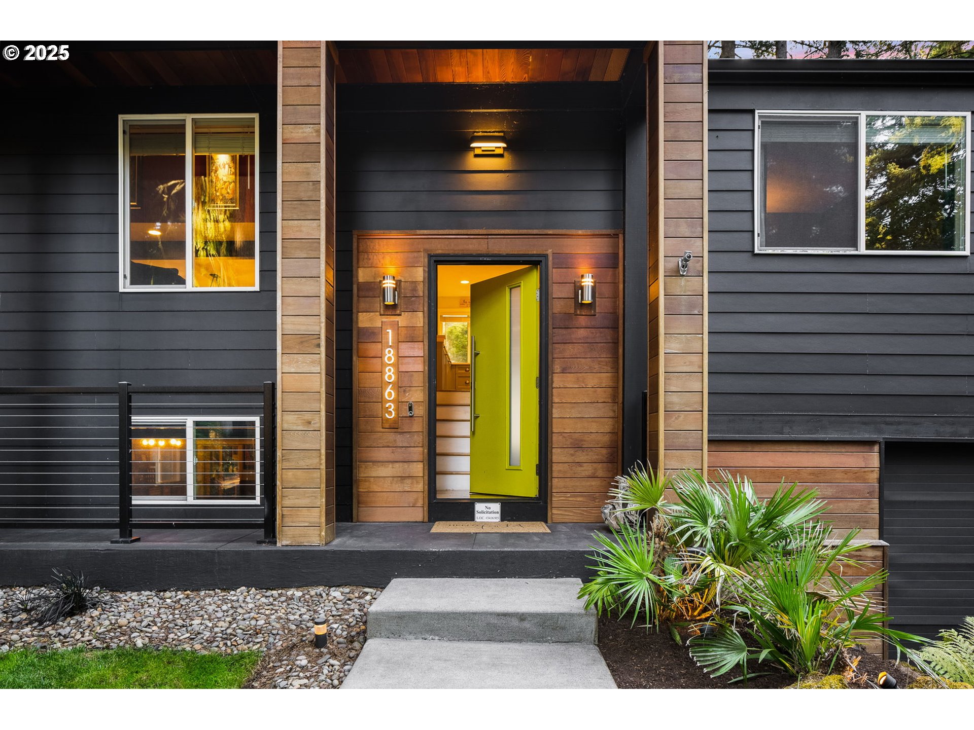 18863 Southwest Indian Springs Road Lake Oswego, OR 97035 - Photo 2 of 33 a front view of a house with a yard