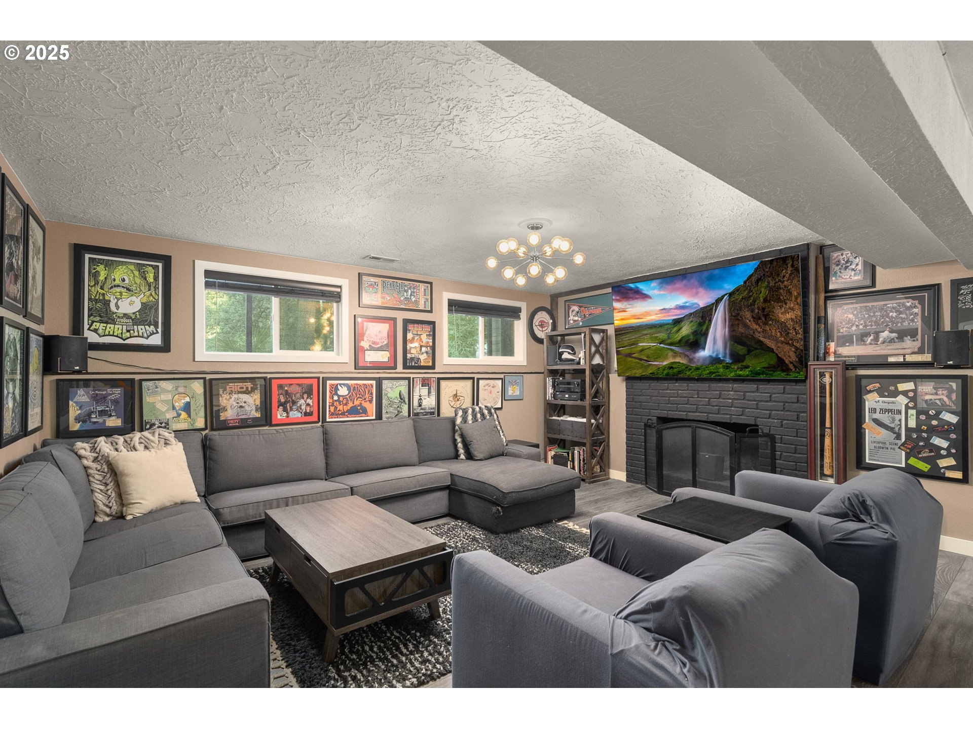 18863 Southwest Indian Springs Road Lake Oswego, OR 97035 - Photo 21 of 33 a living room with furniture a fireplace and a chandelier