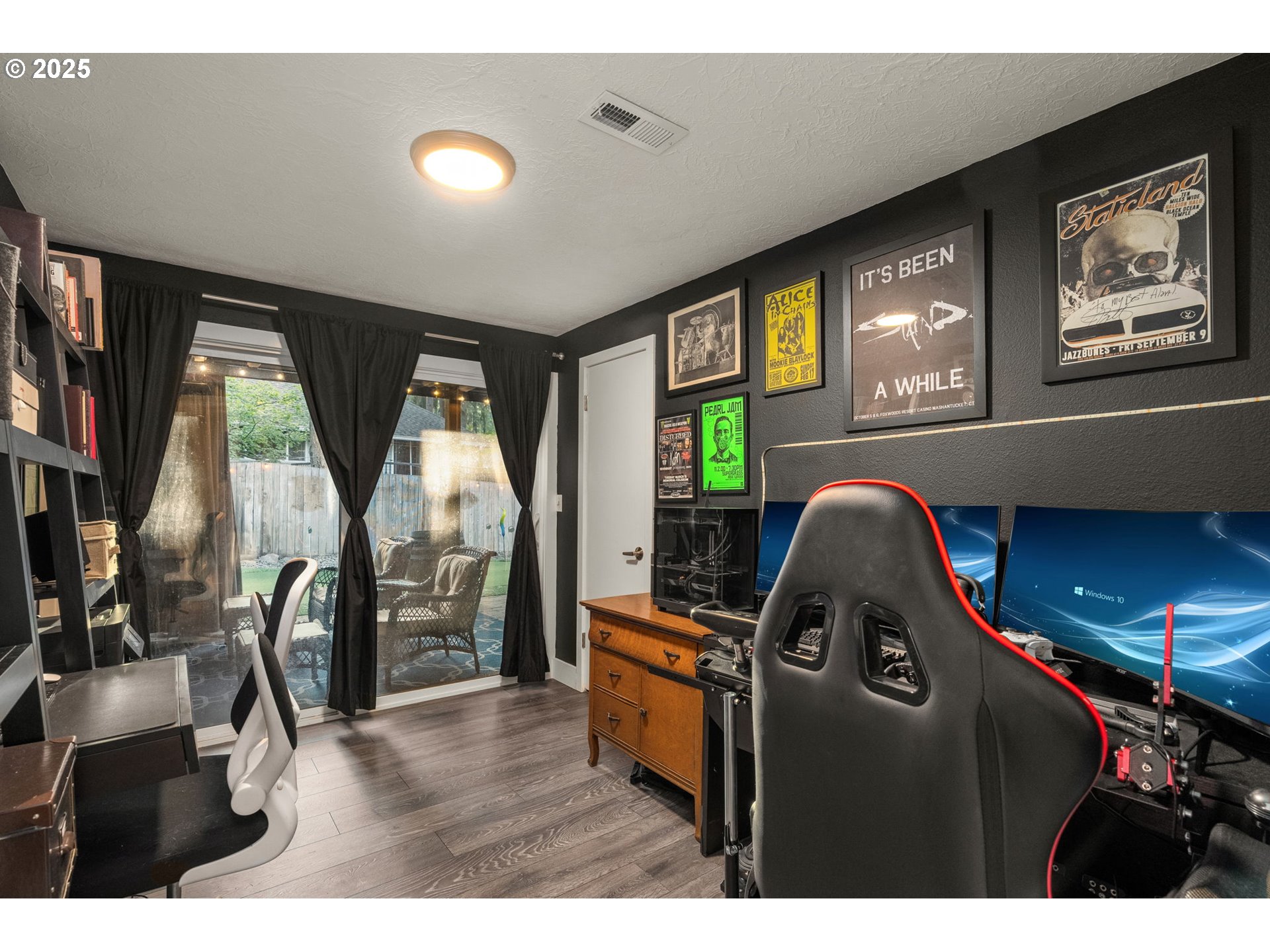 18863 Southwest Indian Springs Road Lake Oswego, OR 97035 - Photo 25 of 33 a living room with furniture a flat screen tv and a large window