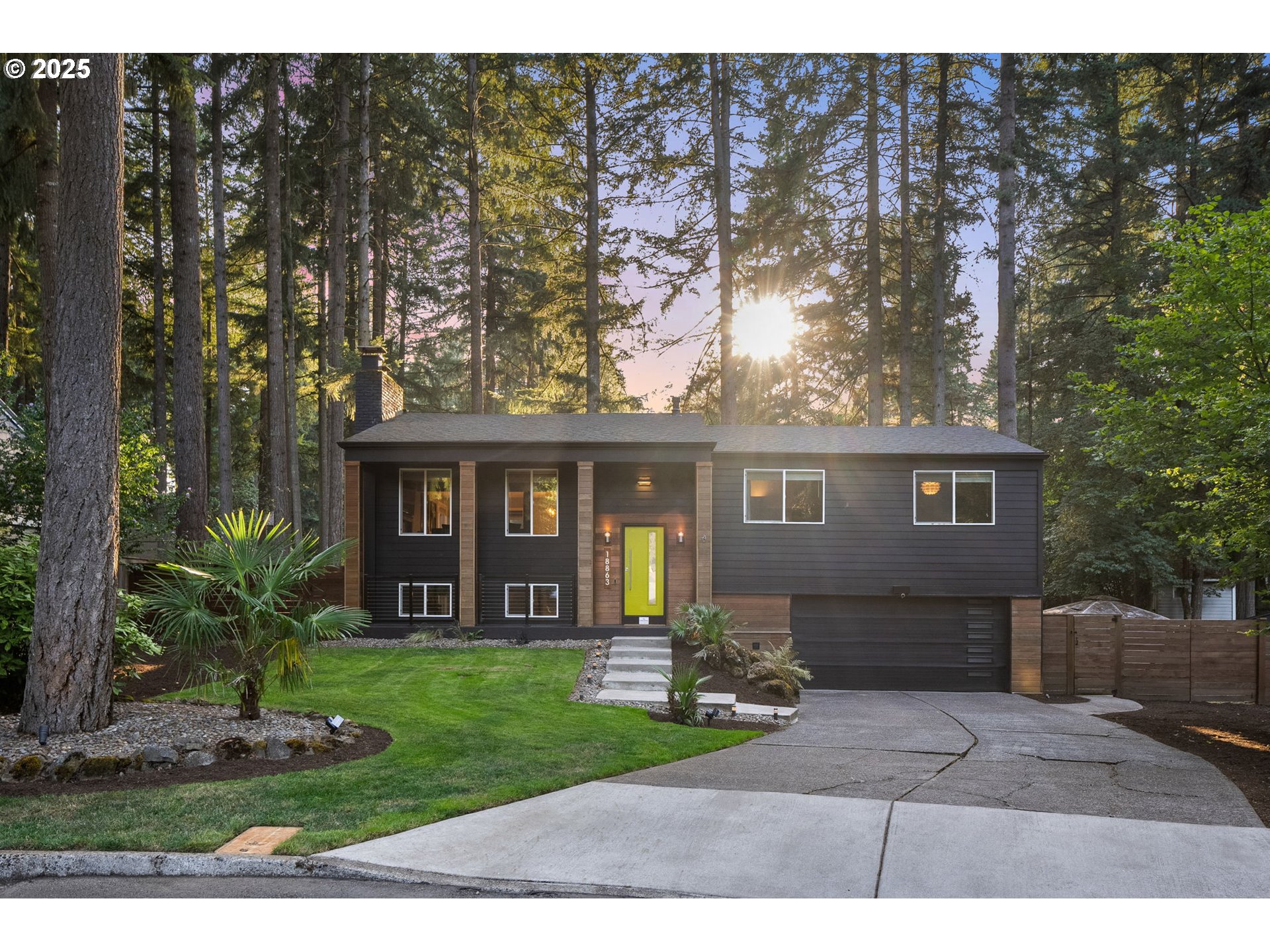 18863 Southwest Indian Springs Road Lake Oswego, OR 97035 - Photo 33 of 33 a front view of a house with a garden and yard