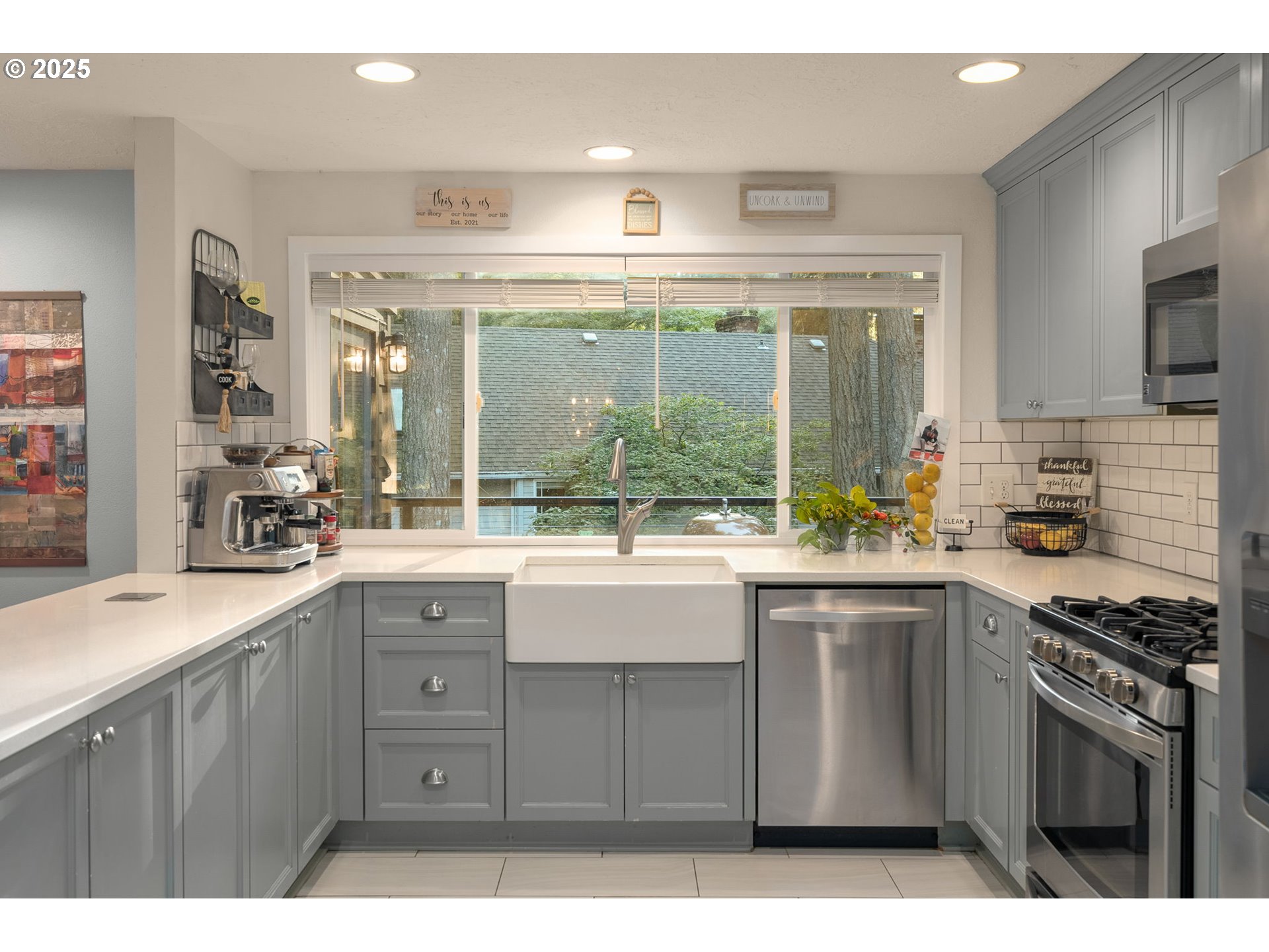 18863 Southwest Indian Springs Road Lake Oswego, OR 97035 - Photo 7 of 33 a kitchen with a sink stove and cabinets