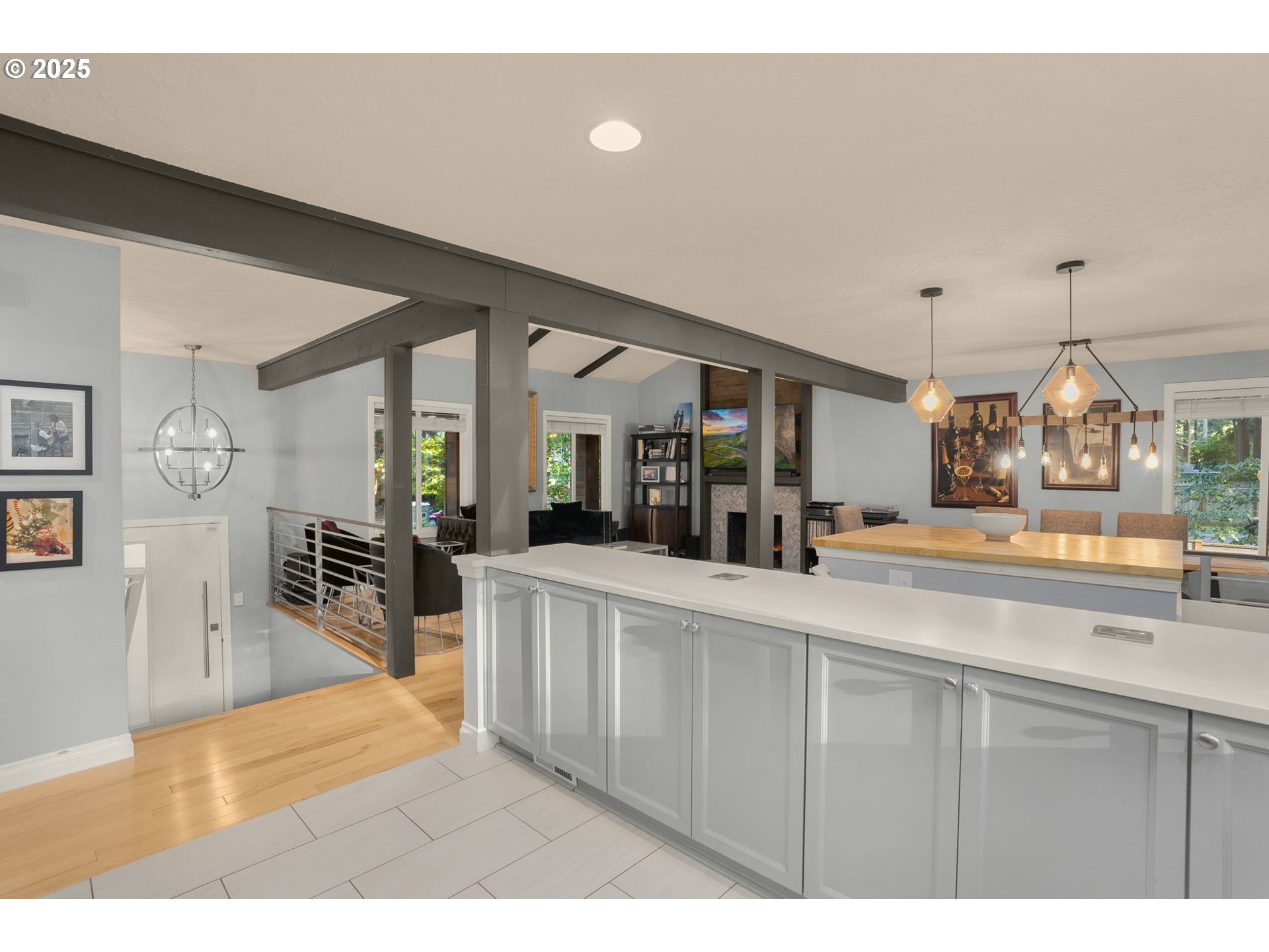 18863 Southwest Indian Springs Road Lake Oswego, OR 97035 - Photo 8 of 33 a living room with stainless steel appliances kitchen island furniture and a chandelier