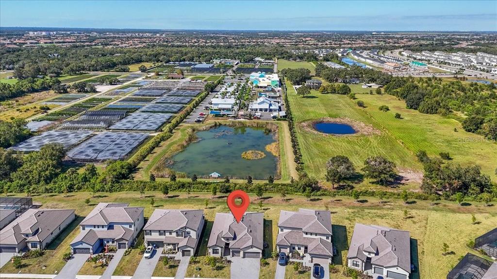 15159 Sea Salt Way Bradenton, FL 34211 - Photo 22 of 55 an aerial view of residential building and lake