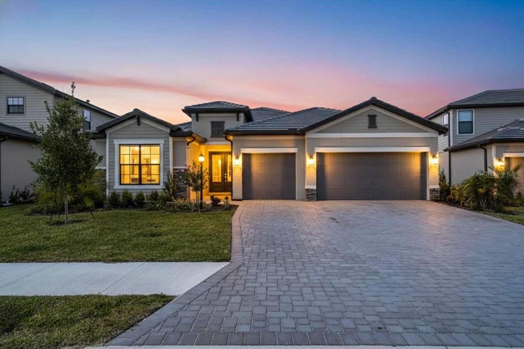 15159 Sea Salt Way Bradenton, FL 34211 - Photo 23 of 55 a front view of a house with a yard and garage