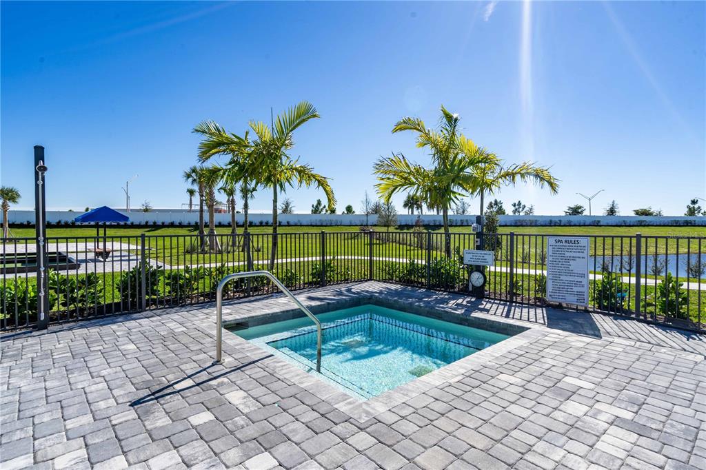 15159 Sea Salt Way Bradenton, FL 34211 - Photo 44 of 55 a view of a swimming pool with a lounge chair