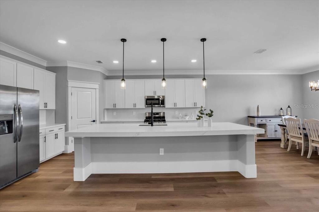 15159 Sea Salt Way Bradenton, FL 34211 - Photo 7 of 55 a view with counter top space a sink appliances and cabinets