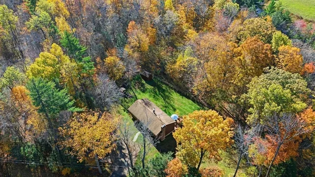 a aerial view of a house with a yard and garden