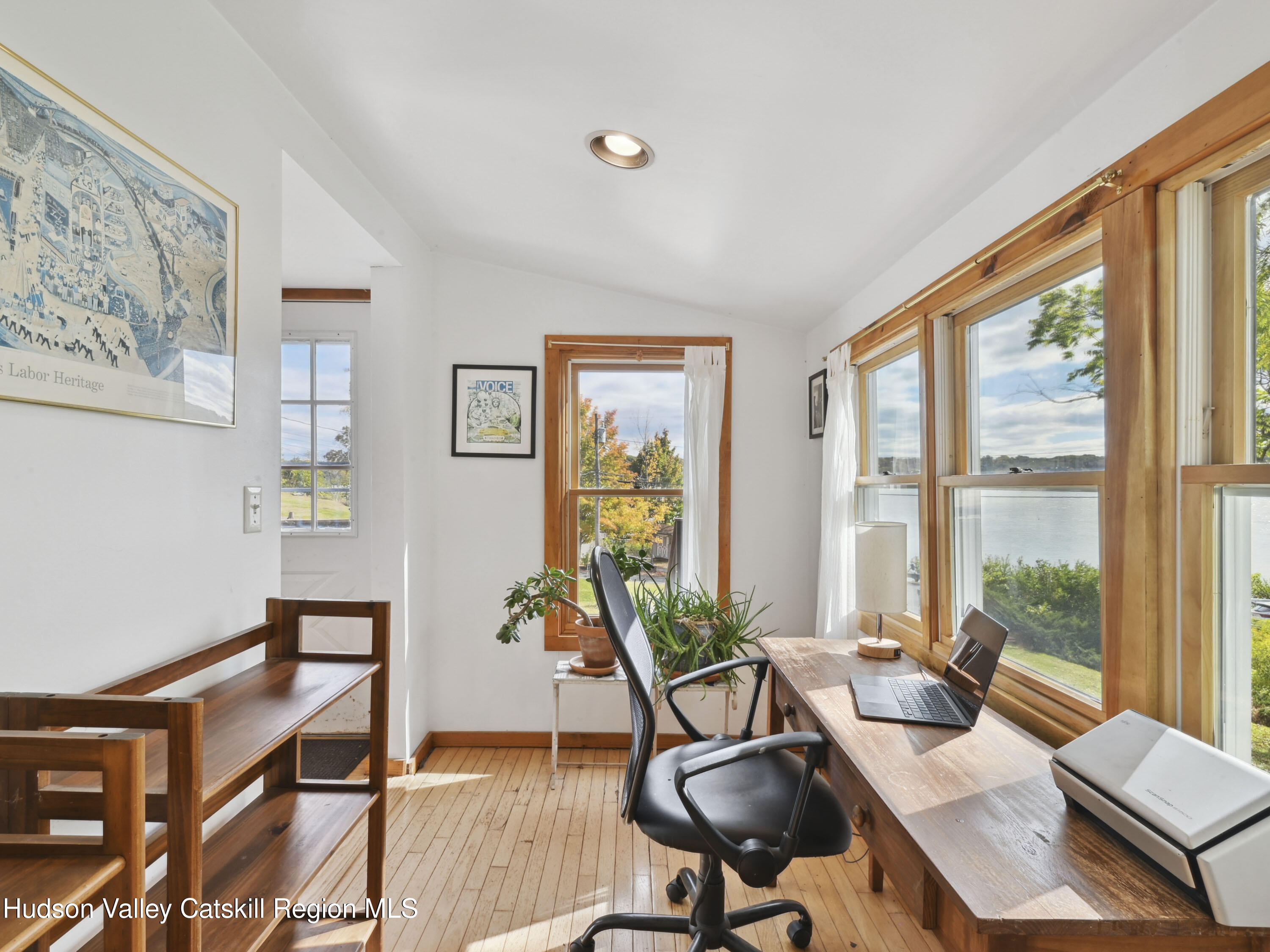 123 Maple Street Catskill, NY 12414 - Photo 21 of 47 a living room with furniture a flat screen tv and a large window