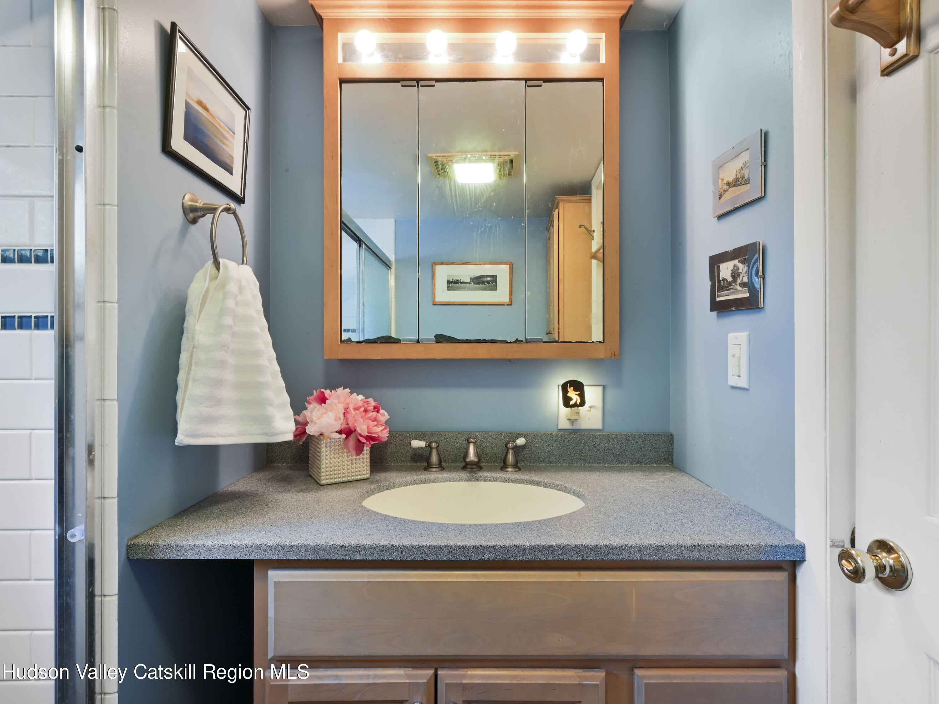 123 Maple Street Catskill, NY 12414 - Photo 23 of 47 a bathroom with a granite countertop sink vanity and mirror