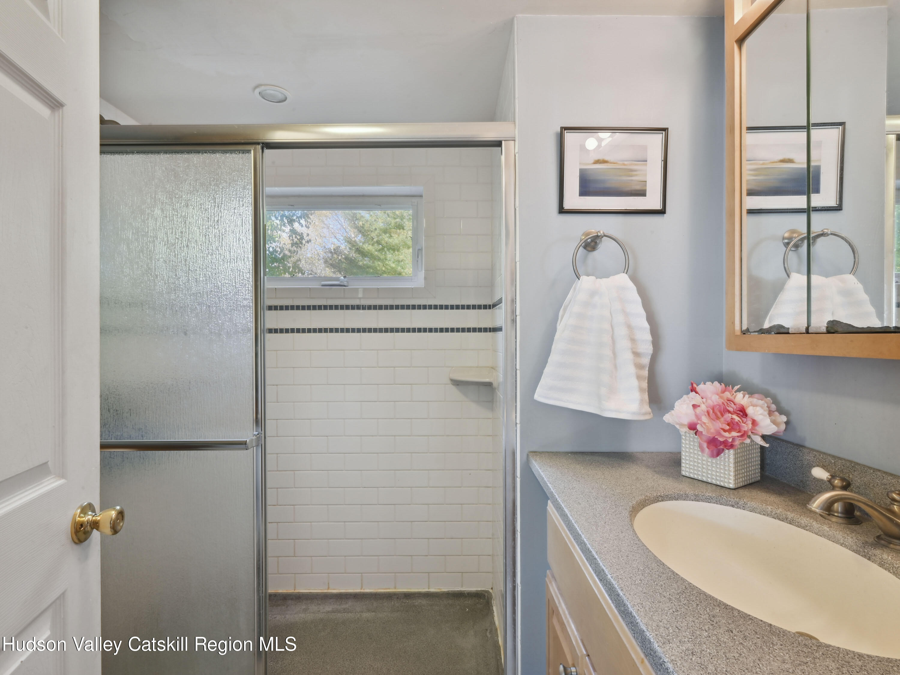 123 Maple Street Catskill, NY 12414 - Photo 24 of 47 a bathroom with a sink mirror and vanity