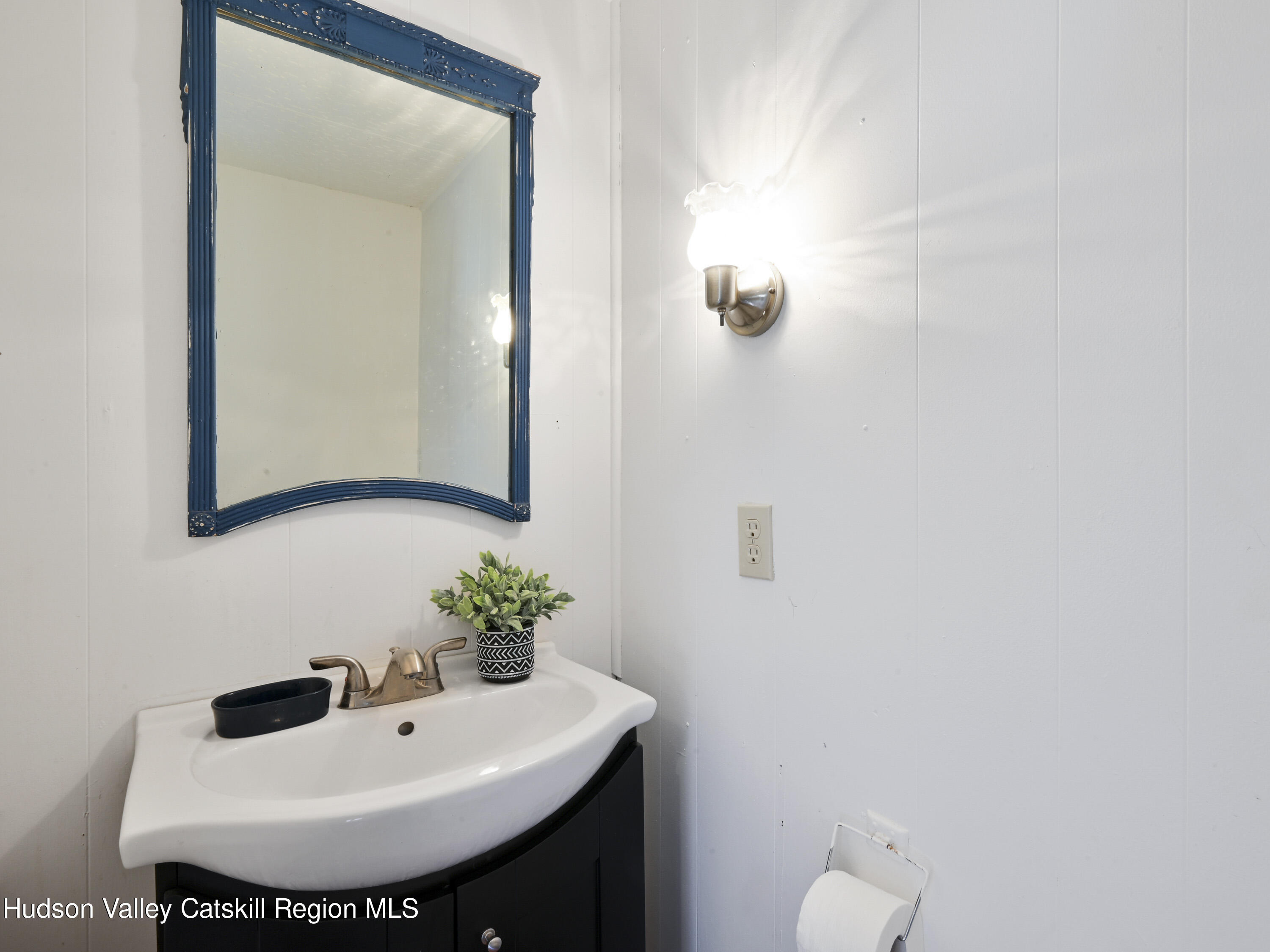 123 Maple Street Catskill, NY 12414 - Photo 29 of 47 a bathroom with a sink and a mirror