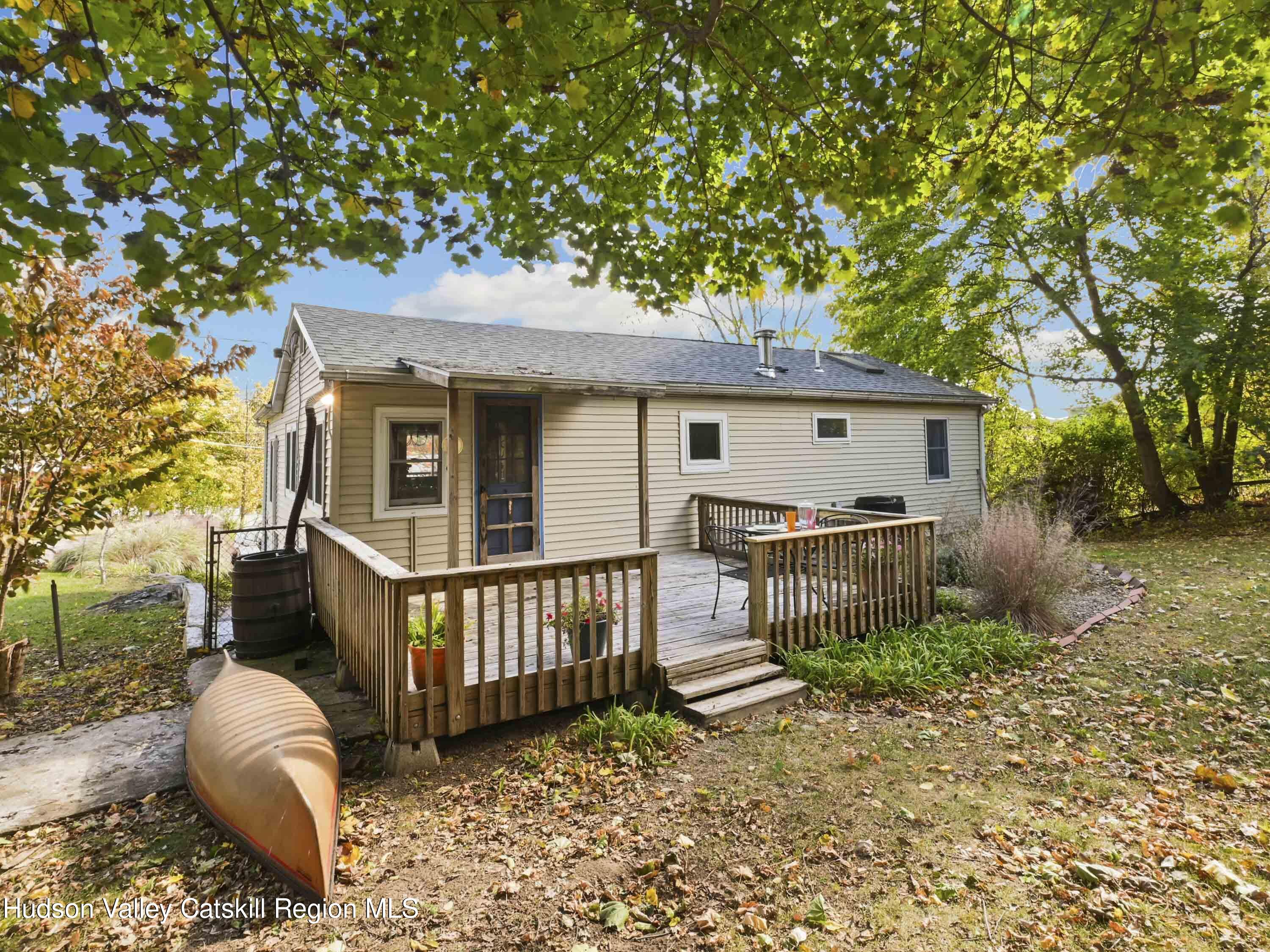 123 Maple Street Catskill, NY 12414 - Photo 34 of 47 a front view of a house with garden and porch