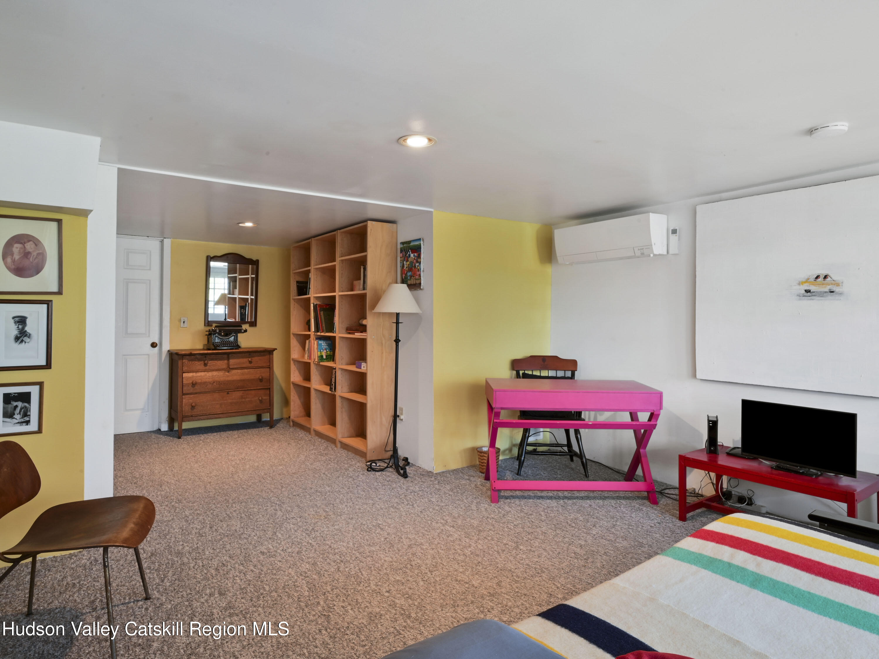 123 Maple Street Catskill, NY 12414 - Photo 37 of 47 a living room with furniture and a flat screen tv