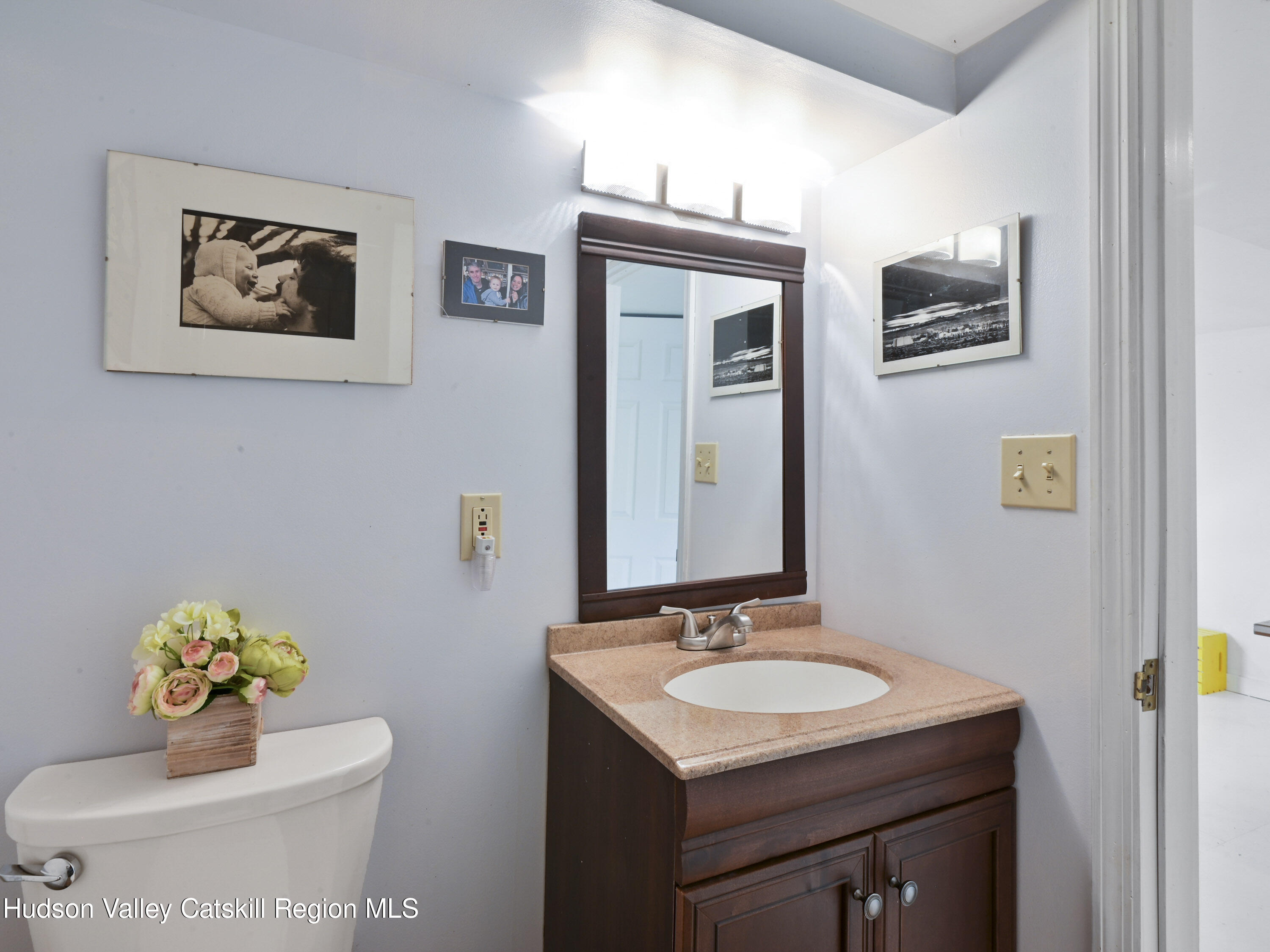 123 Maple Street Catskill, NY 12414 - Photo 40 of 47 a bathroom with a sink mirror and vanity