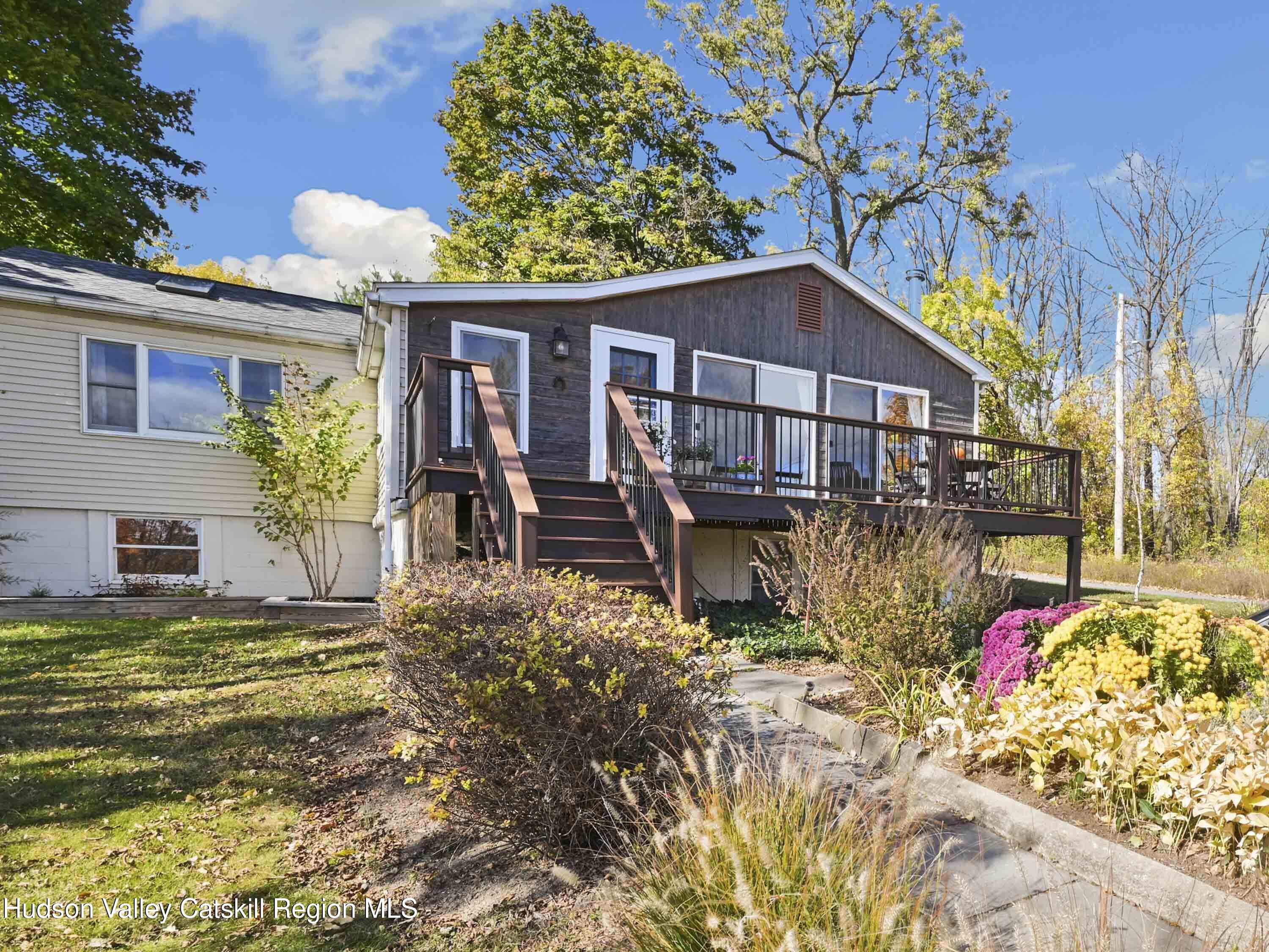 123 Maple Street Catskill, NY 12414 - Photo 46 of 47 a view of a house with a yard and a garden