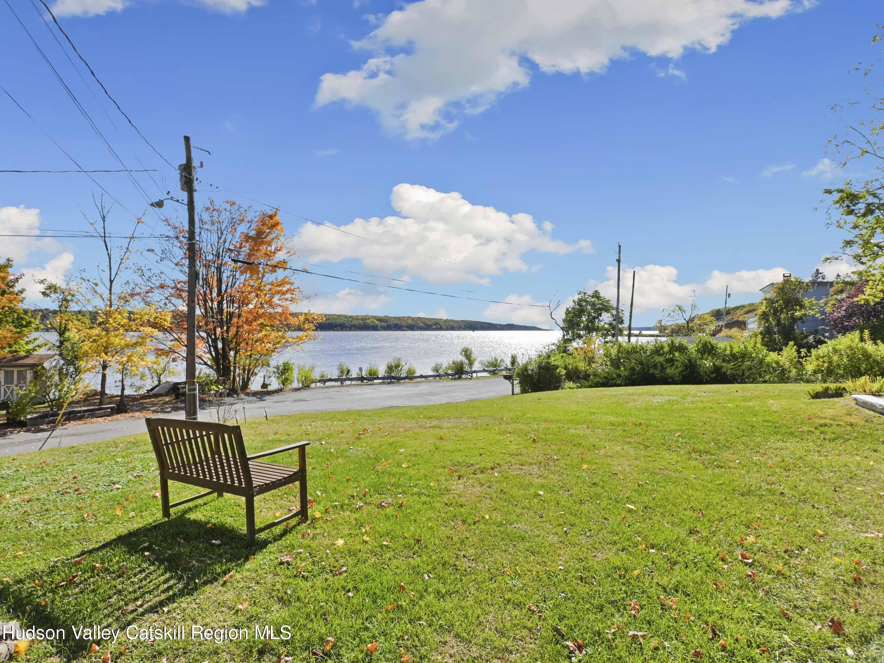 123 Maple Street Catskill, NY 12414 - Photo 8 of 47 a view of a swimming pool and lounge chairs