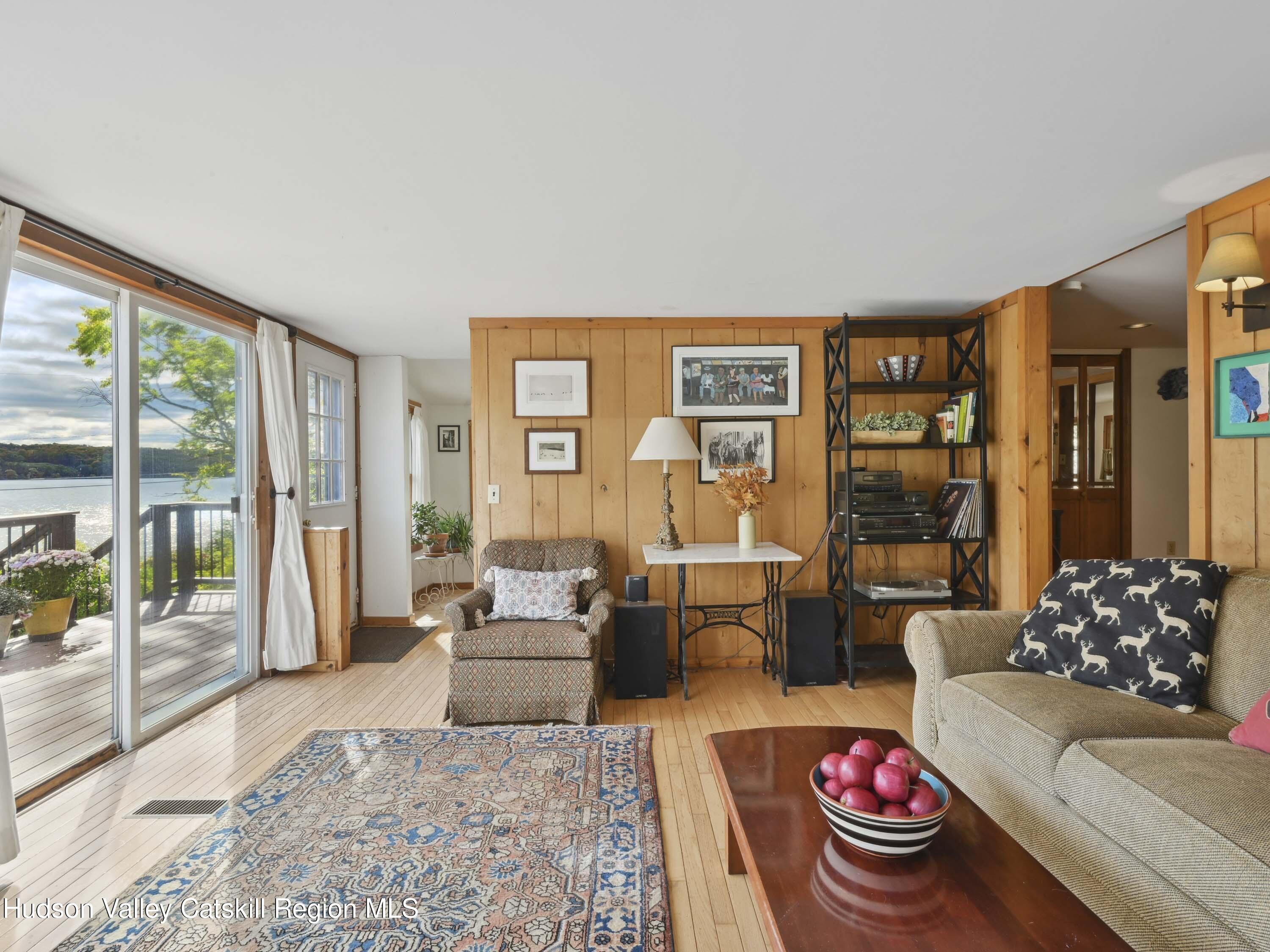 123 Maple Street Catskill, NY 12414 - Photo 10 of 47 a living room with furniture and a large window
