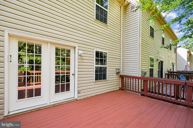 a view of a wooden deck and a yard
