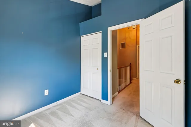 a view of a house with a porch and furniture