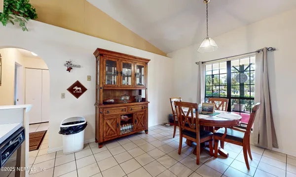 a view of a dining room with furniture window and outside view