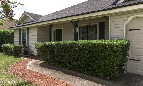 front view of a house with a small yard