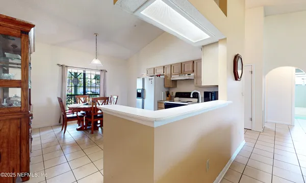 a kitchen with a cabinets and a table