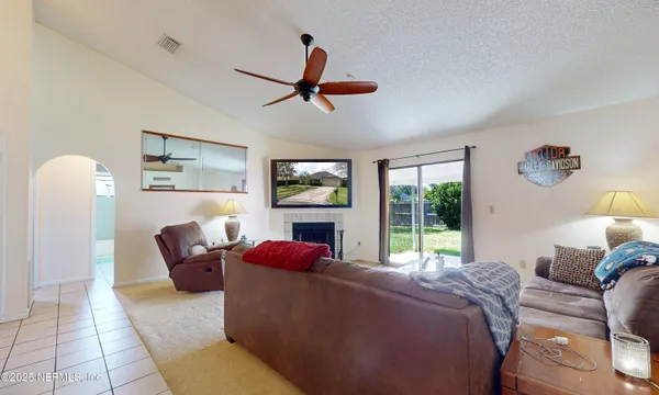 a bed room with a bed a couch and a window