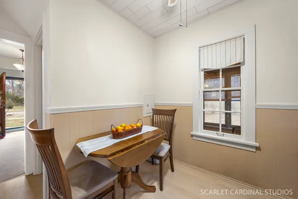 a view of a workspace with furniture and window