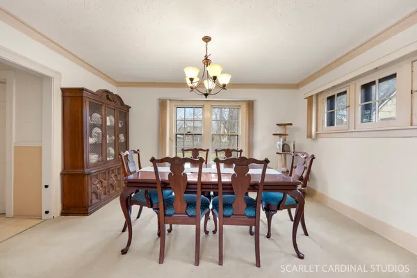 a view of a dining room with furniture window and outside view