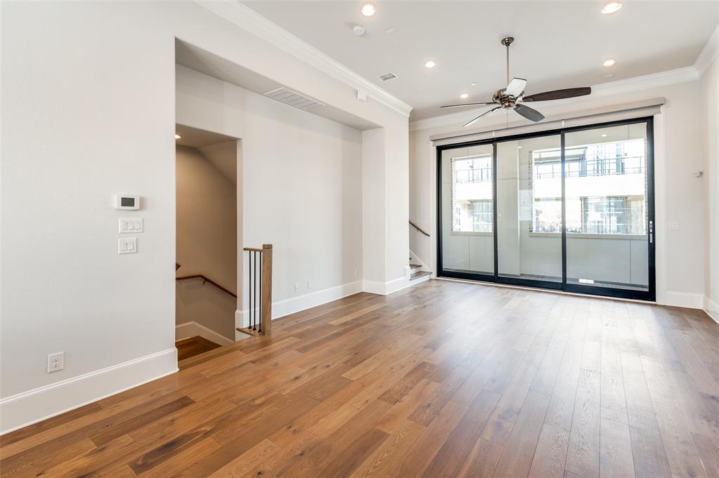 5421 Patterson Street Irving, TX 75039 - Photo 22 of 32 Spacious room featuring wood-finish flooring, high ceilings with recessed lighting, and a ceiling fan