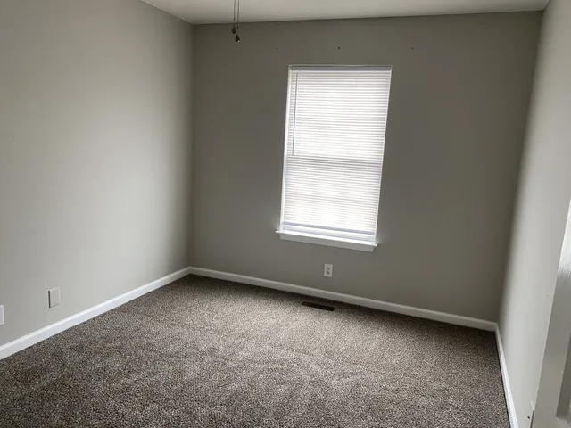 a white toilet sitting next to a bath tub