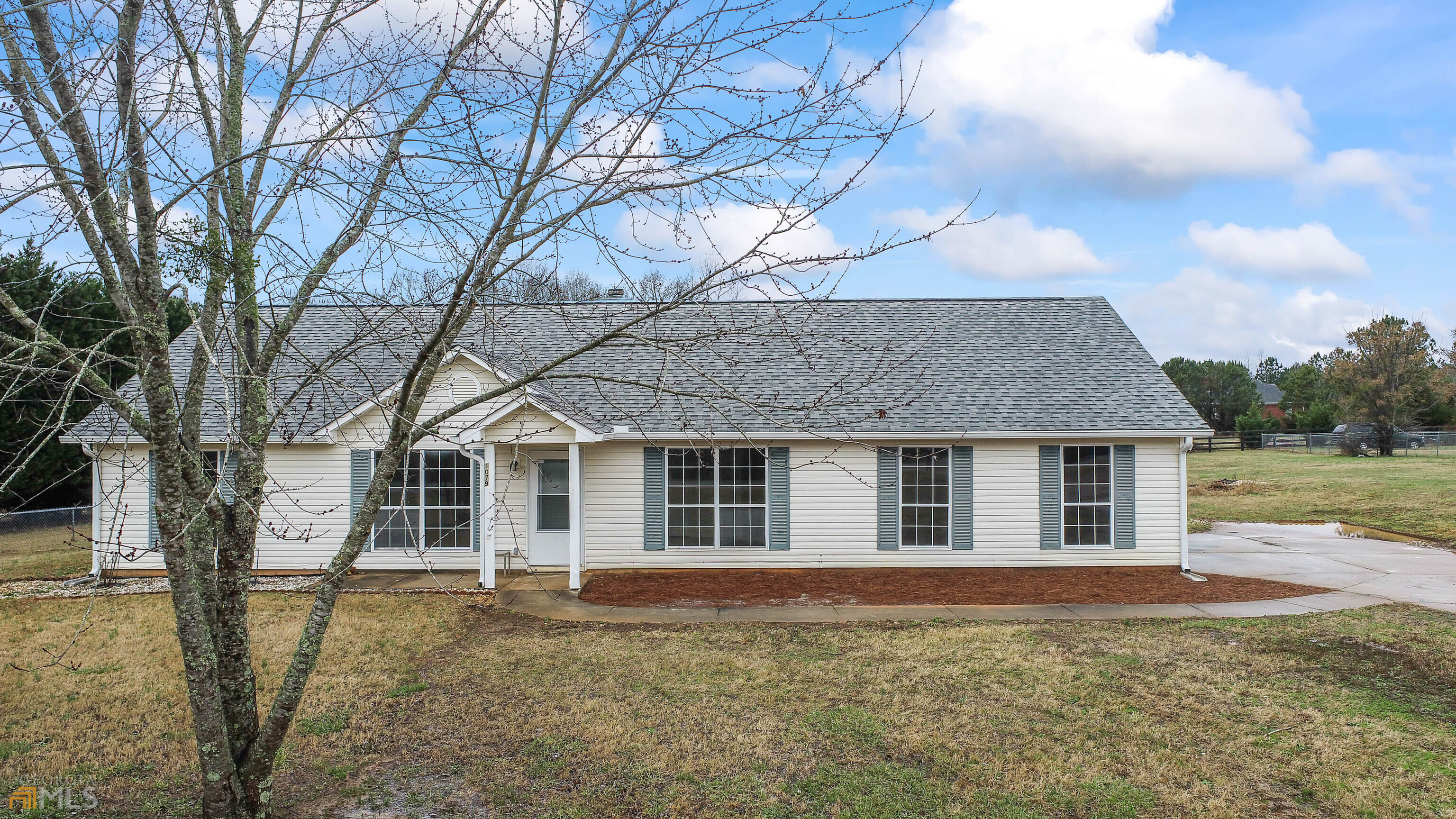 1079 North Unity Grove Road Locust Grove, GA 30248 - Photo 1 of 1 a view of a yard in front of house