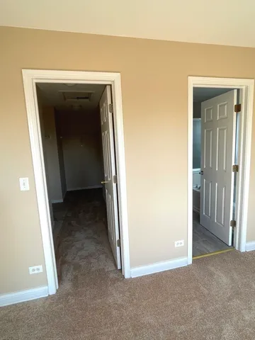 a bathroom with a granite countertop sink a mirror and a bathtub