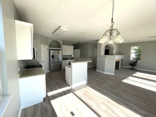 a view of living room and kitchen