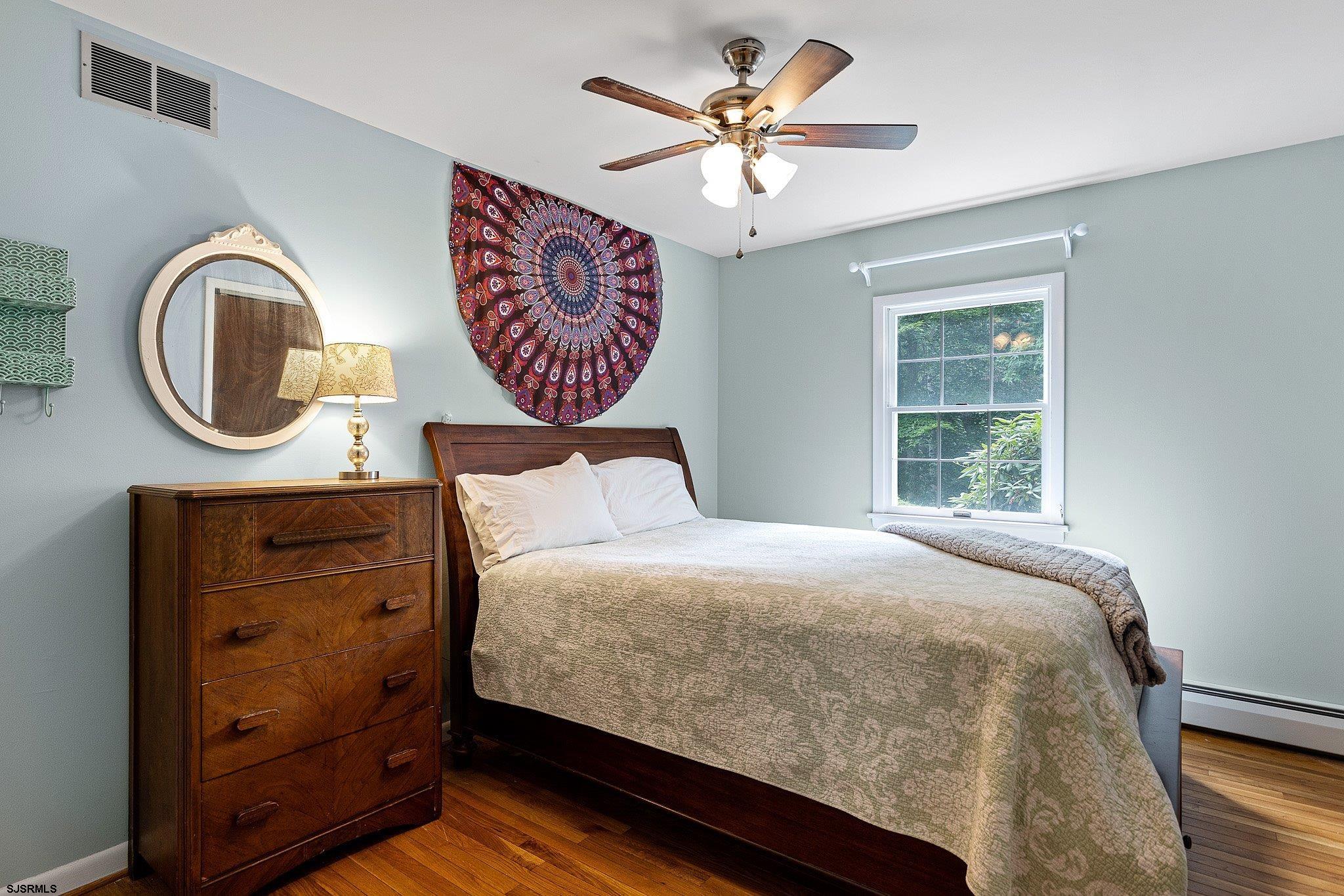 108 Weatherby Road Mullica Hill, NJ 08062 - Photo 13 of 18 a bedroom with a bed and a window