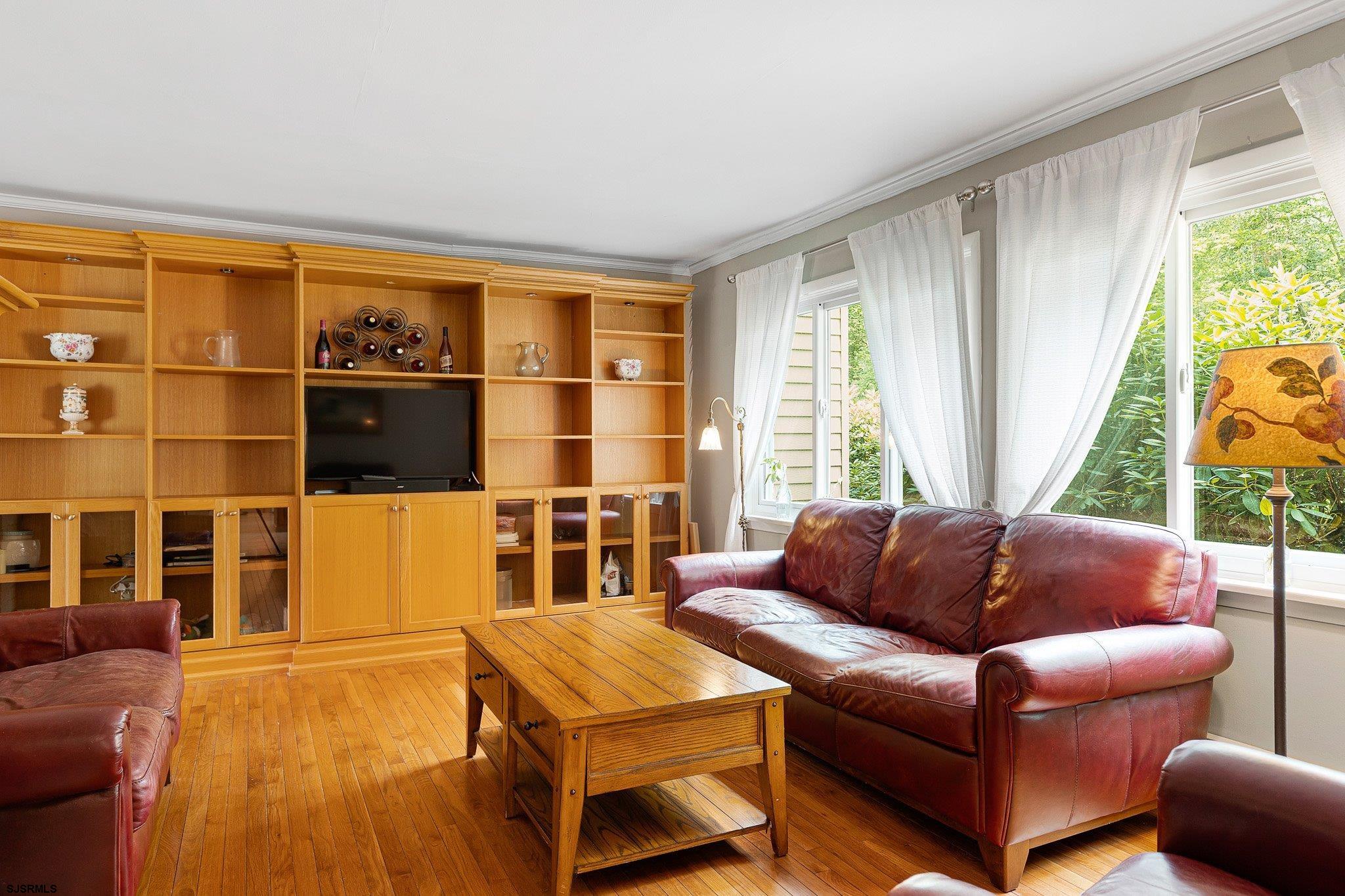 108 Weatherby Road Mullica Hill, NJ 08062 - Photo 5 of 18 a living room with furniture and a floor to ceiling window
